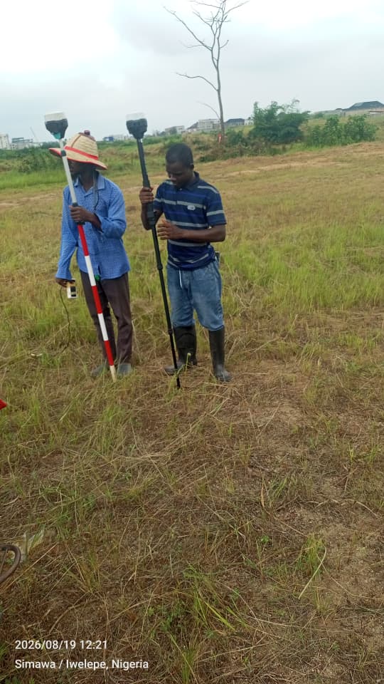Geokreate survey team conducting GNSS observations on open land